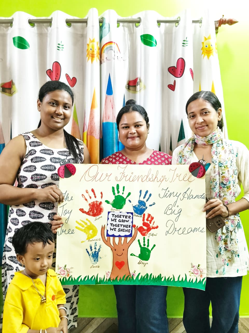 Happy children learning in a bright, nurturing classroom at Buds & Blossoms