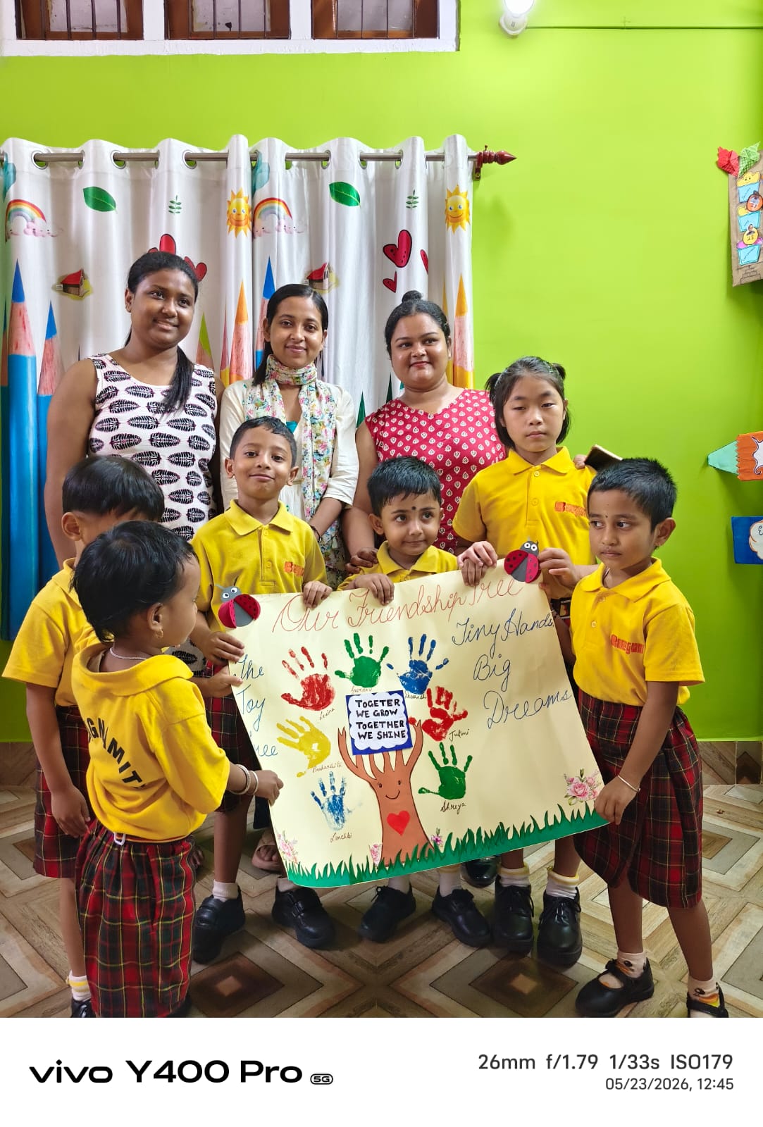 Teachers and students with Friendship Tree artwork