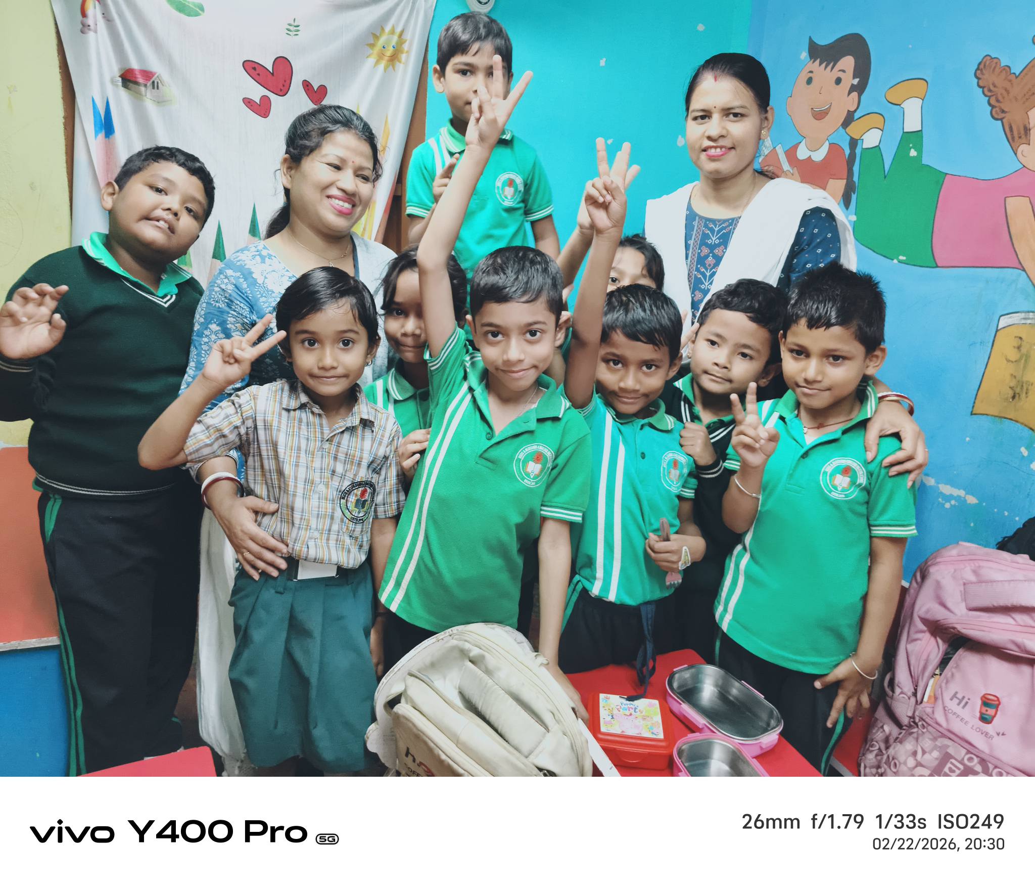 Teacher giving personalised attention to a small group of children